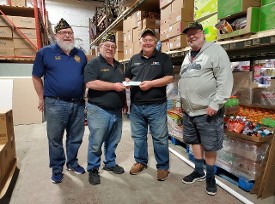 Don Hawkins & Davis Sassman accepting a donation from American Legion Commanders 