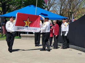 General Mutter presenting the Honor & Remember flag to