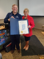 Indiana Director of Veterans Affairs, Dennis Wimer, presenting Jill Fewell with the Distinguished Hoosier Award