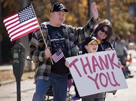 Family Holding Thank You Sign